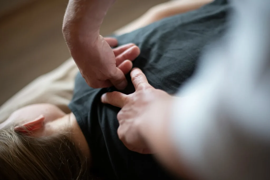 doctor-examining-patient-back